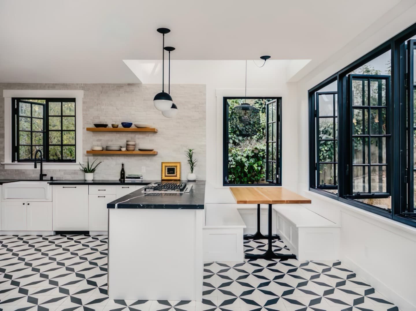 Renovated Craftsman kitchen with geometric tile floor, soapstone counters, and open shelving